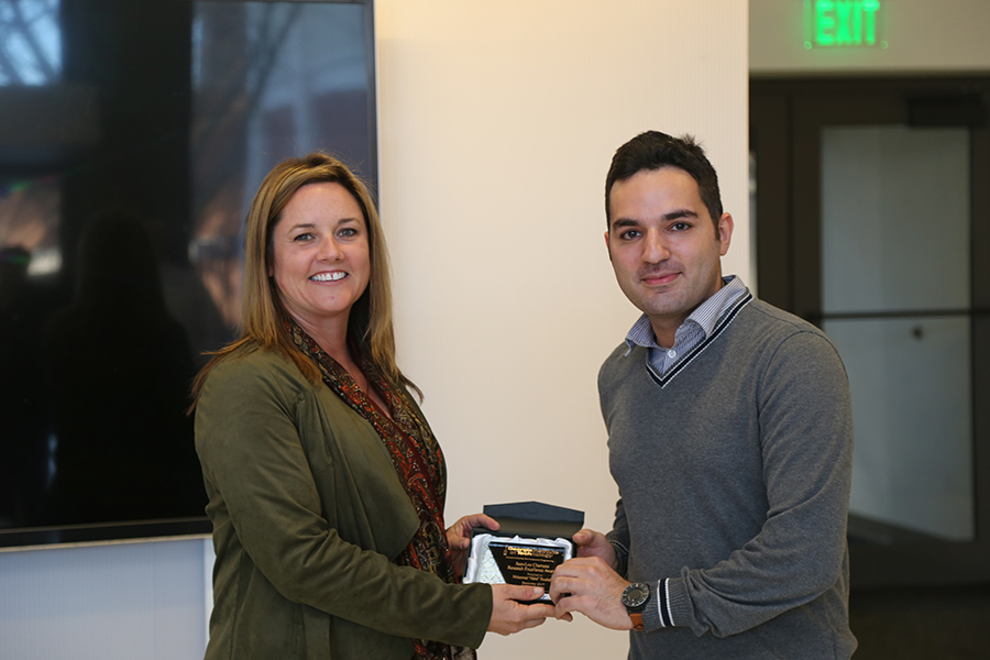 Mahdi Roozbahani receives his award from Interim School Chair Kimberly Kurtis. (Photo: Jess Hunt-Ralston)