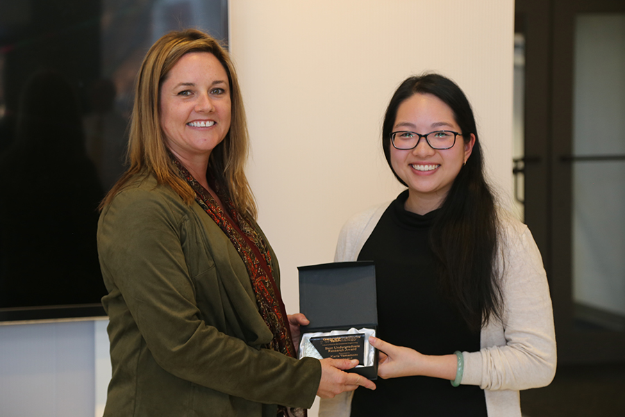 Karie Yamamoto receives her award from Interim School Chair Kimberly Kurtis. (Photo: Jess Hunt-Ralston)