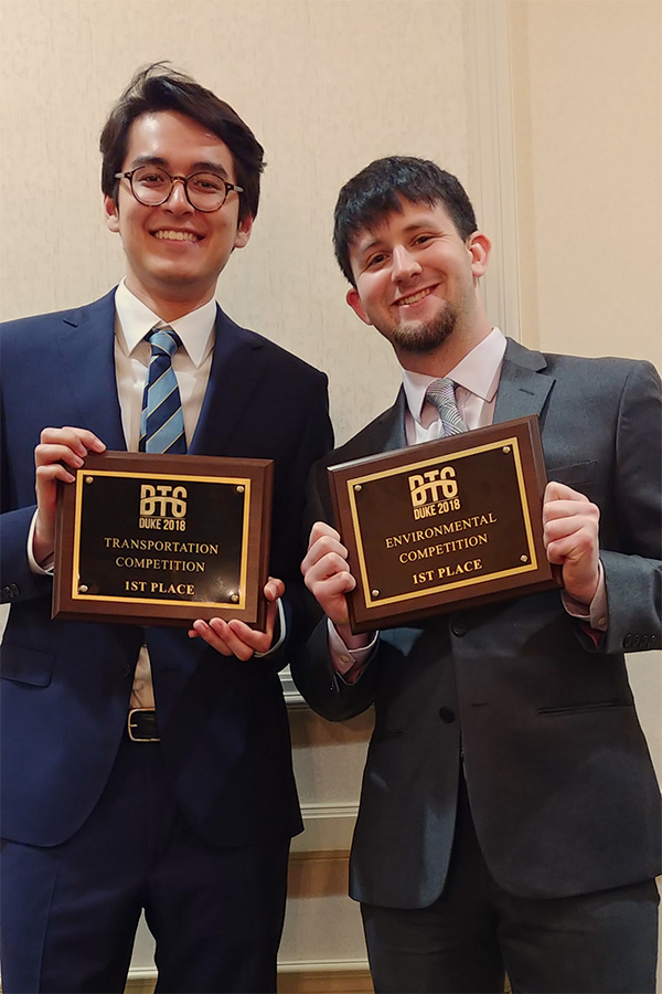 Transportation team leader Juwon LP Drake and environmental team member Taylor Thomas with their first-place awards. (Photo: Lin Htet Kyaw)