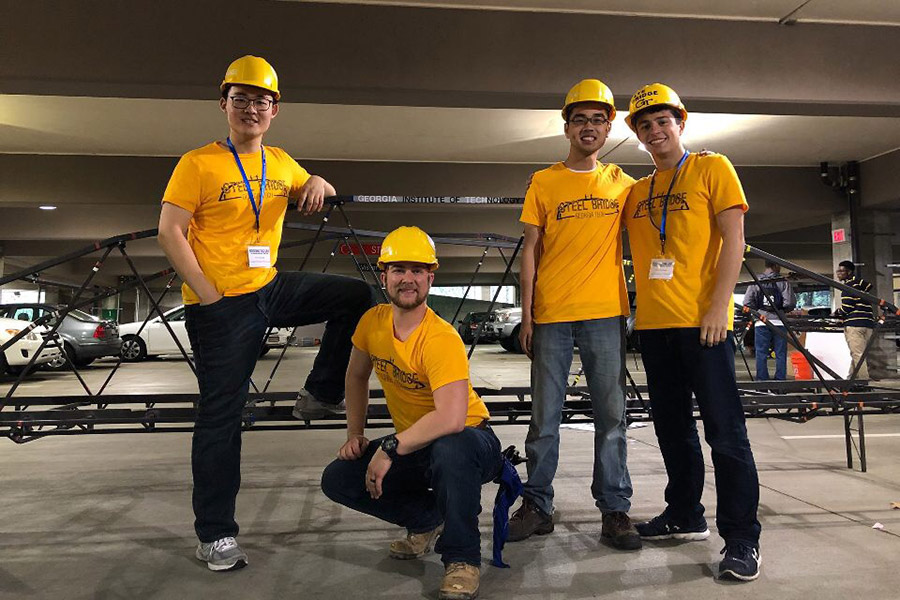 The ASCE chapter’s steel bridge build team, left to right: Zonglin “Jack” Li, Josh Buth, Jason Tam and Peter Psaltakis. (Photo: Annie Yu Meng)