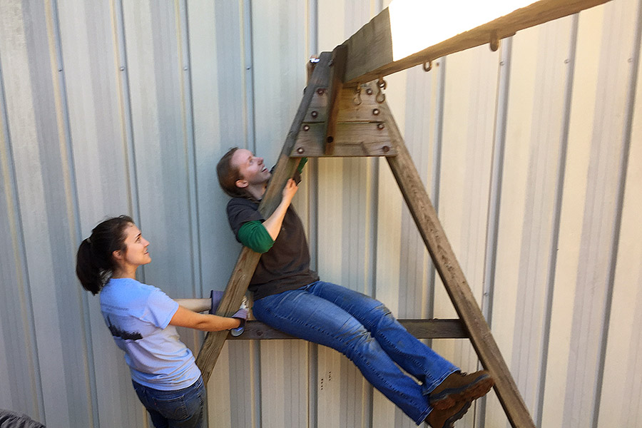 Caroline Stanton and Alesa Stallman from the Georgia Tech chapter of the American Society of Civil Engineers prepare to take down a swing set on International Women's House playground in Decatur, Georgia. (Photo Courtesy: ASCE Georgia Tech)