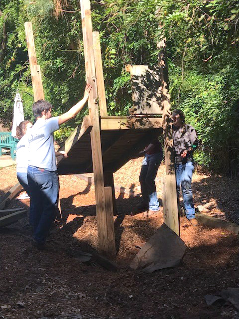 Students from the Georgia Tech chapter of the American Society of Civil Engineers take down a piece of playground equipment for International Women's House in Decatur, Georgia. (Photo Courtesy: ASCE Georgia Tech)