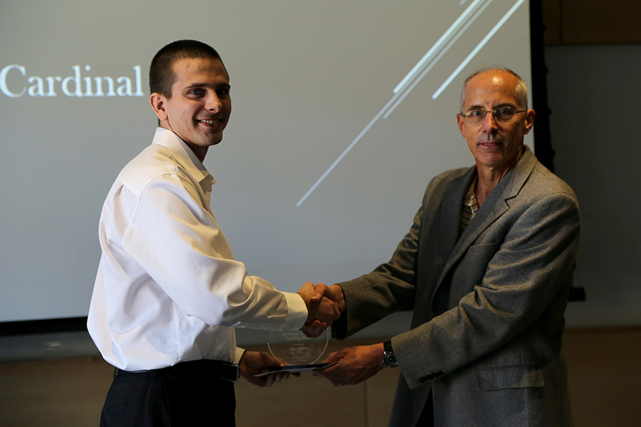 Jack Cardinal receives his award from Ted Russell