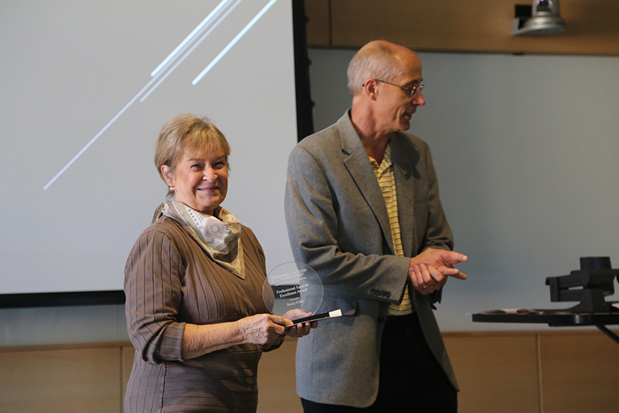 Becky Colter receives her award from Ted Russell