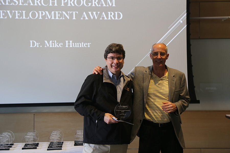 Mike Hunter receives his award from Ted Russell