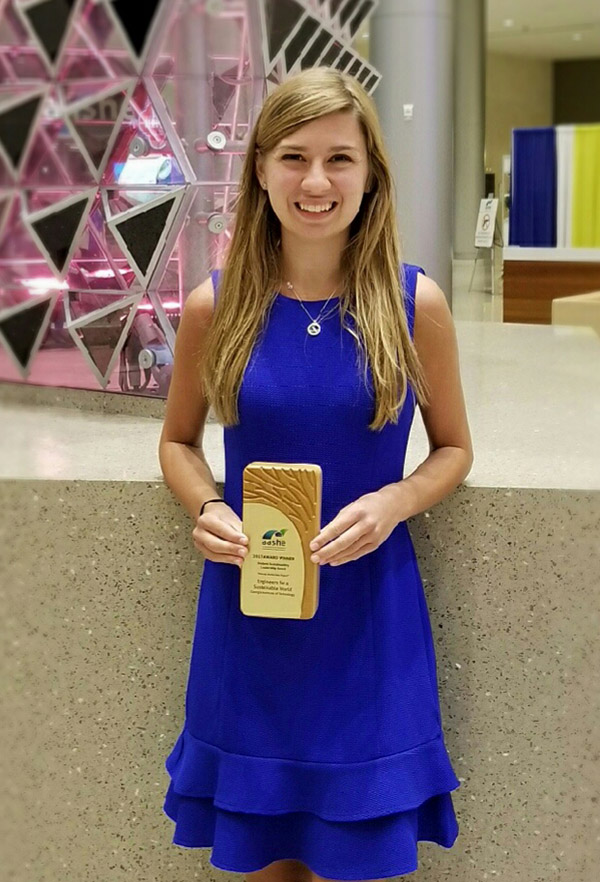 Grace Brosofsky, BSEnvE 2017, stands with her Student Sustainability Leadership award from the Association for the Advancement of Sustainability in Higher Education. (Photo Courtesy: Grace Brosofsky)