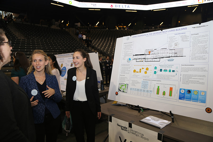 Members of team Pontus Engineering Anat Revai and Hannah Greenwald talk about their senior design project at the Capstone Design Expo. (Photo: Jess Hunt-Ralston)