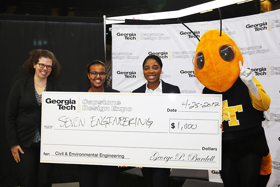 Team SEVEN Engineering with Buzz and Associate Professor Kari Watkins after they won for the best project among civil and environmental engineering teams at the spring 2017 Capstone Design Expo. (Photo: Jess Hunt-Ralston)