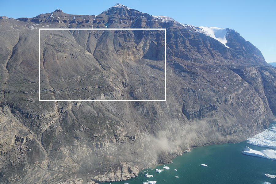 The scarred hillside Greenland's Karrat Fjord after a lanslide fell a kilometer (about 3,300 feet) into the water below, causing a tsunami that reached 300 feet high and has been blamed for four deaths in a nearby town. On the left, another landslide remains active and three towns remain evacuated.