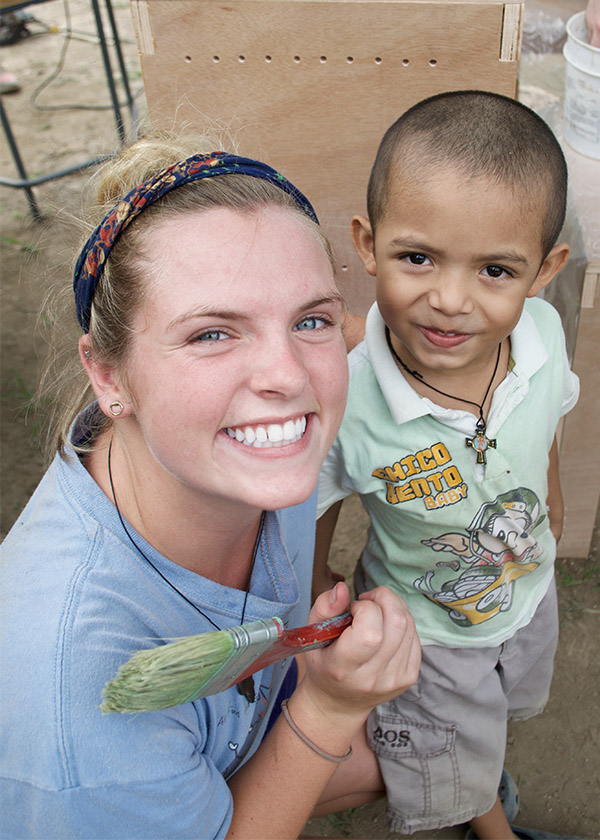 Senior Maggie Lindsey in Costa Rica with one of the young students who will attend a primary school she helped design and build. Lindsey has won second place in the American Society of Civil Engineers Daniel W. Mean Student Prize competition for her essay about professional ethics for engineers working in foreign countries. (Photo: Maggie Lindsey)