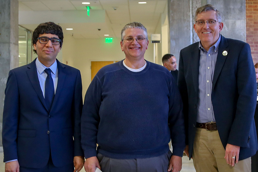 David Scott, center, receives his award from awards committee chair Arash Yavari, left, and School Chair Donald Webster.  (Photo: Amelia Neumeister)