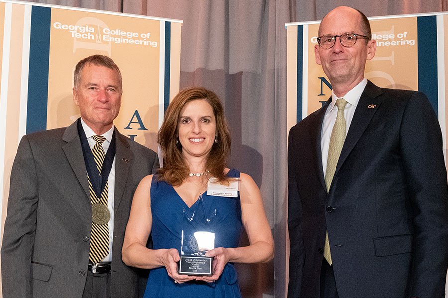 From left, ceremony co-host retired Adm. James A. “Sandy” Winnefeld, Stacie Sire, and engineering Dean Steve McLaughlin. (Photo: Gary Meek)