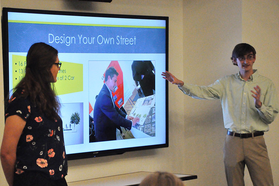 Jack Glodek, right, and Anna Peterson tell judges at the Ted Turner Drive Resiliency Corridor Challenge about their community engagement event where they used a game to ask people how they would balance cars, bikes, pedestrians, green space and parking along the roadway in downtown Atlanta. The city wants to turn the drive into a gateway for downtown Atlanta that showcases sustainability, equity, social cohesion and mobility. (Photo: Joshua Stewart)