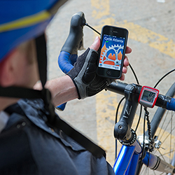 Man checking app while riding a bike