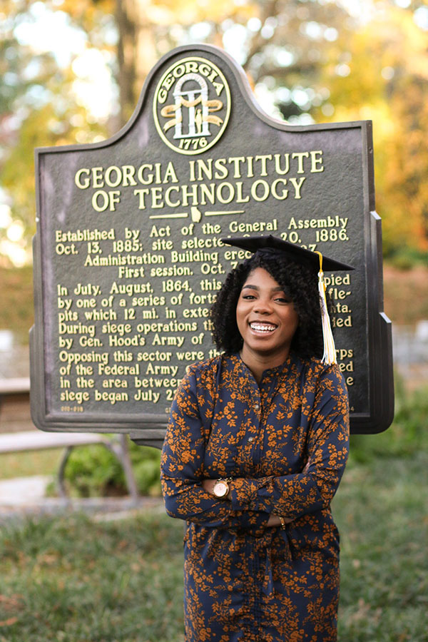 Sharani White poses with her graduation cap at the Georgia Tech historical marker near Tech Tower. (Photo: Titilayo Funso)