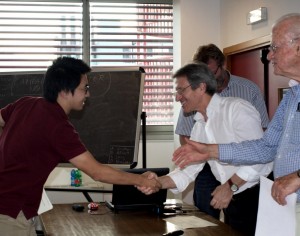 Fanzhou Liu shaking hands with his teachers at LARAM