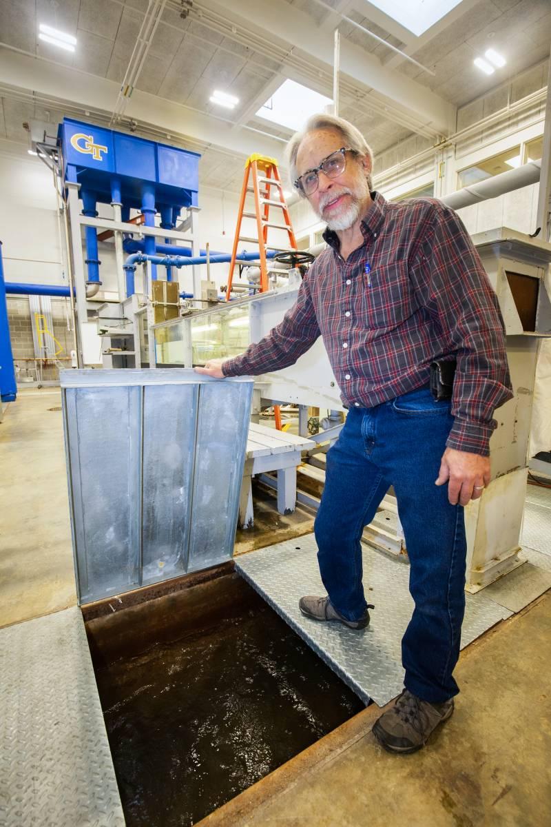 Lab manager Andrew Udell shows off the underground sump, which collects water under the lab.