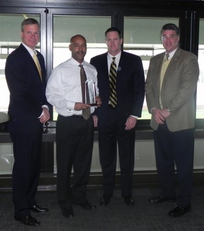 Dr. Reginald DesRoches accepting the Subaru Professor of Excellence award with GT President Bud Peterson.