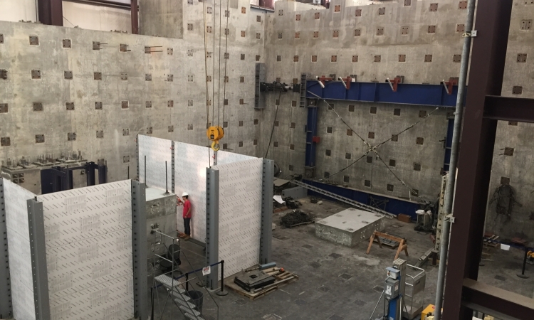 A large open facility and person wearing a hardhat