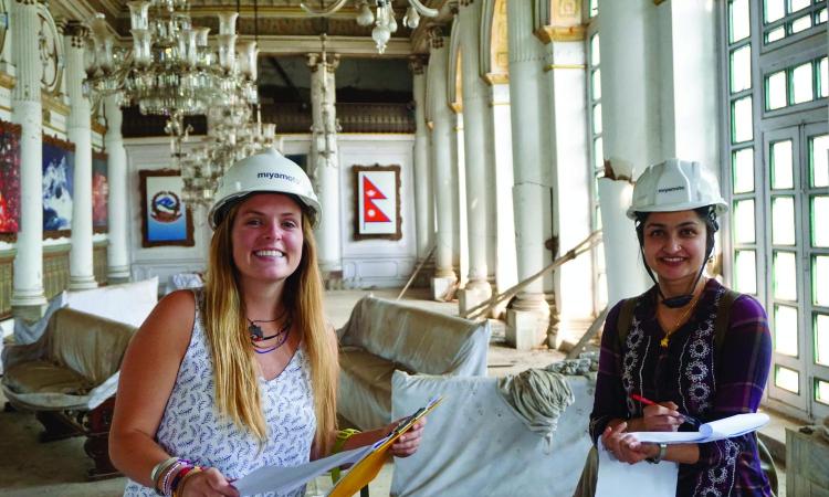 Two women wearing hard hats