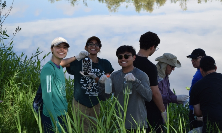 A group of students collecting water samples