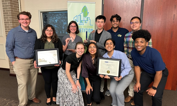 The Georgia Tech ASCE Sustainable Solutions team pose with their trophy after winning first place.