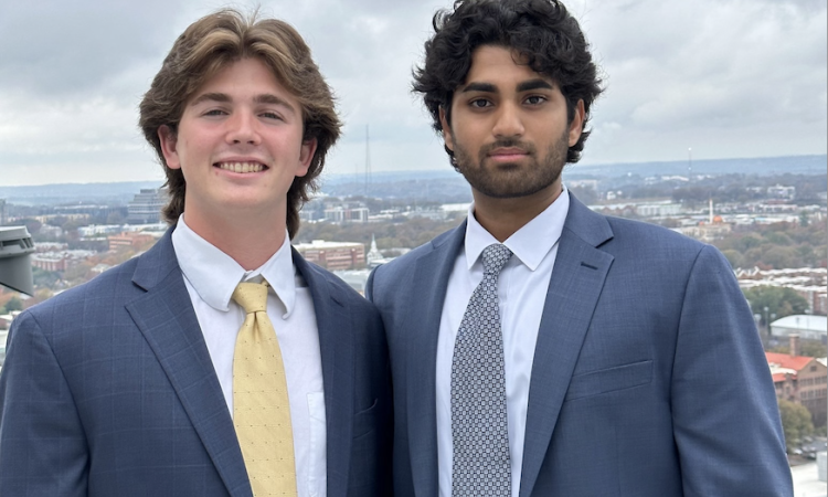 A photo of two young men wearing coats and ties 