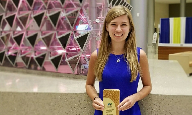 Grace Brosofsky, BSEnvE 2017, stands with her Student Sustainability Leadership award from the Association for the Advancement of Sustainability in Higher Education. (Photo Courtesy: Grace Brosofsky)
