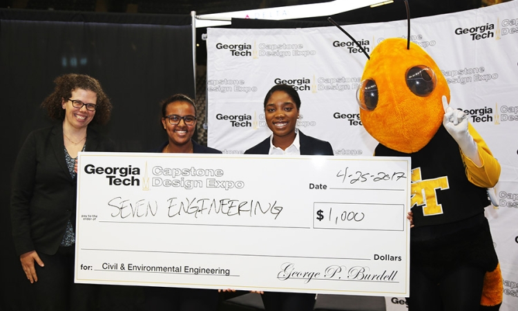 Team SEVEN Engineering with Buzz and Associate Professor Kari Watkins after they won for the best project among civil and environmental engineering teams at the spring 2017 Capstone Design Expo. Kemeria Abdella and Sharani White, middle, designed a full site development plan for a proposed medical office building in Cobb County, Georgia, along with Cathy Wong and Ming Yang. (Photo: Jess Hunt-Ralston)