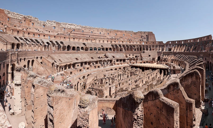 Roman arenas have survived in many earthquake-prone regions. Did the Romans inadvertently build seismic wave cloaks when they designed colosseums? Some researchers believe they did due to the arenas' resemblance to modern experimental elastodynamic cloaking devices. (Photo: Paolo Costa Baldi via Wikimedia Commons)