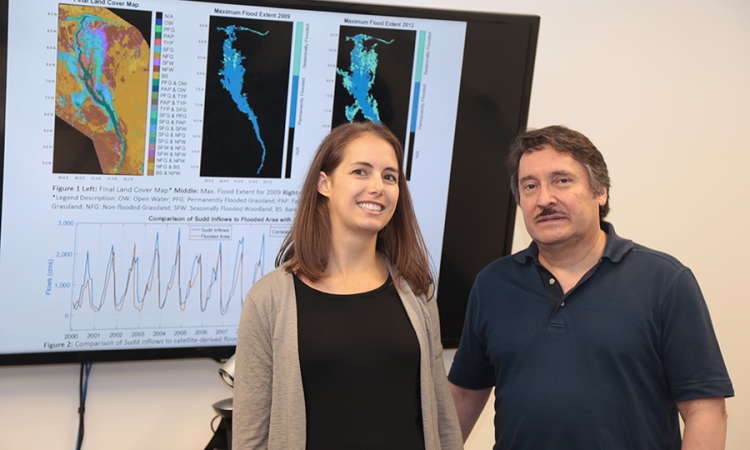 Courtney Di Vittorio, left, with her Ph.D. adviser, Aris Georgakakos and some of the data she's using for her research. Di Vittorio's work to incorporate satellite data into hydrologic models so decision-makers can improve water management plans has won her a 2017 Earth and Space Science Fellowship from NASA. (Photo: Jess Hunt-Ralston)