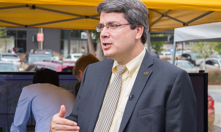 Associate Professor Michael Hunter explains his work with the North Avenue Smart Corridor at the ribbon-cutting event for the roadway. Hunter appeared on WABE-FM's Closer Look Sept. 26 to talk about his work on autonomous vehicles, one of the technologies that will be tested along North Avenue. (Photo Courtesy: Georgia Tech Institute for People and Technology)