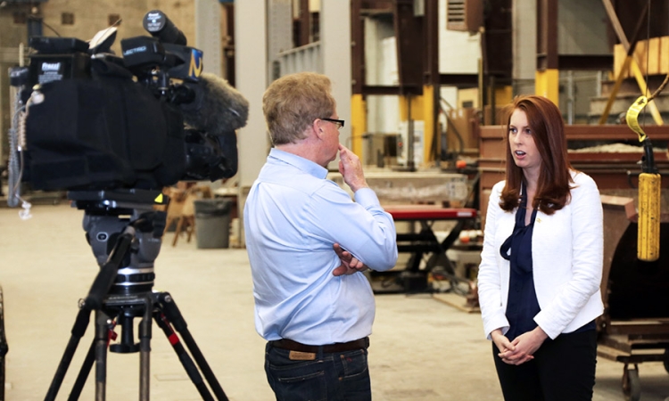 Lauren Stewart talks with WSB-TV's Tom Regan about the Interstate 85 bridge collapse in Atlanta. Stewart said coordinated investigationsof the cause, cleanup of the site, and reconstruction of the highway will likely take months. She was among a handful of School of Civil and Environmental Engineering researchers who offered their engineering expertise to Atlanta and national media in the wake of the disaster. (Photo: Jess Hunt-Ralston)