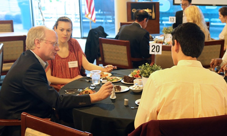 Art Williams talks with students at the School of Civil and Environmental Engineering's first scholarship and fellowship lunch. Williams and his family created the F. Everett Williams Scholarship for civil engineering students. (Photo: Joshua Stewart)