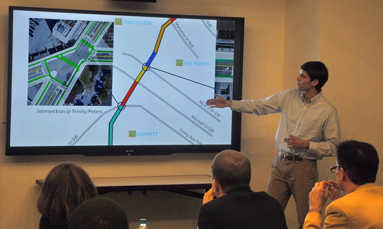Andrew Pofahl explains to judges some of the design ideas his Delft Blauw Design team proposed for Ted Turner Drive in downtown Atlanta. Two teams of Georgia Tech students offered redesigns of the road for the Ted Turner Drive Resiliency Corridor Challenge. Delft Blauw Designs won second place in the competition. (Photo: Joshua Stewart)