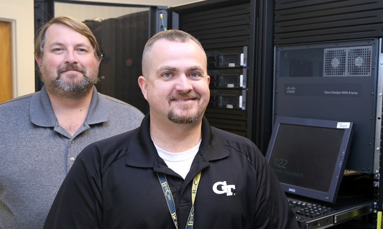 Veterans John Temple and Mike Anderson in one of the School of Civil and Environmental Engineering server rooms. The pair now provide information technology support to the School's students, faculty and staff. (Photo: Joshua Stewart)