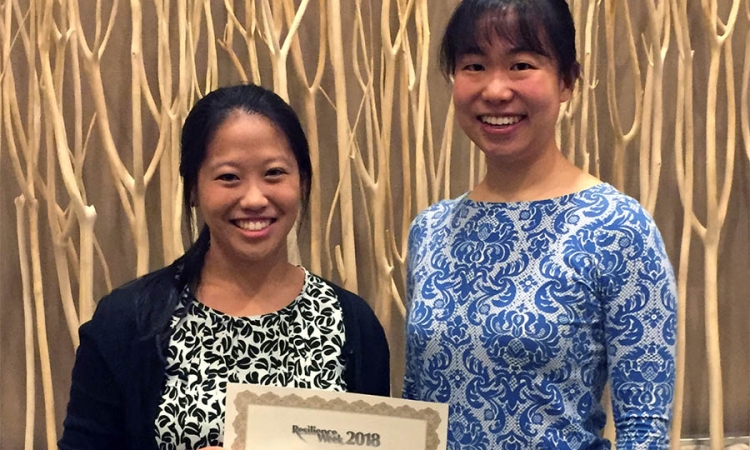 Graduate student Cynthia Lee, left, and Assistant Professor Iris Tien with their first-place infrastructure paper aware at Resilience Week 2018. (Photo Courtesy: Iris Tien)