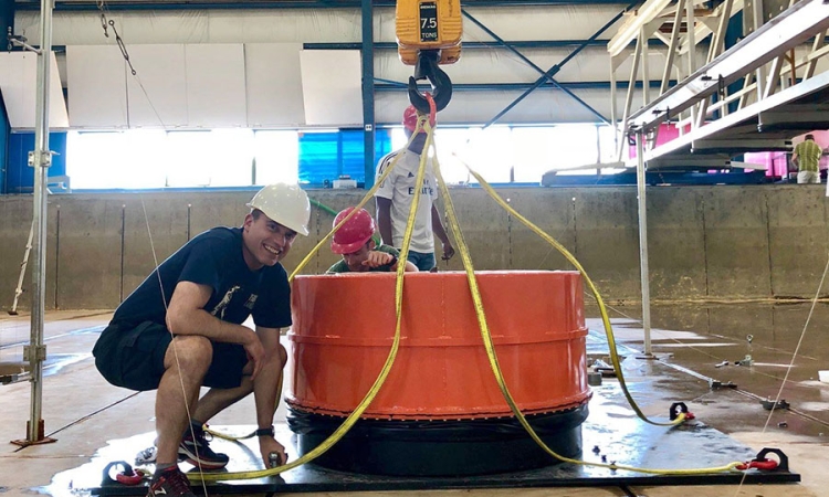 Hermann Fritz helping install the Volcanic Tsunami Generator at the O.H. Hinsdale Wave Research Laboratory at Oregon State University earlier this summer. (Photo: Angela Del Rosario / Courtesy: Natural Hazards Engineering Research Infrastructure)