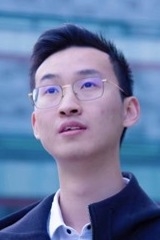 Headshot of man in glasses