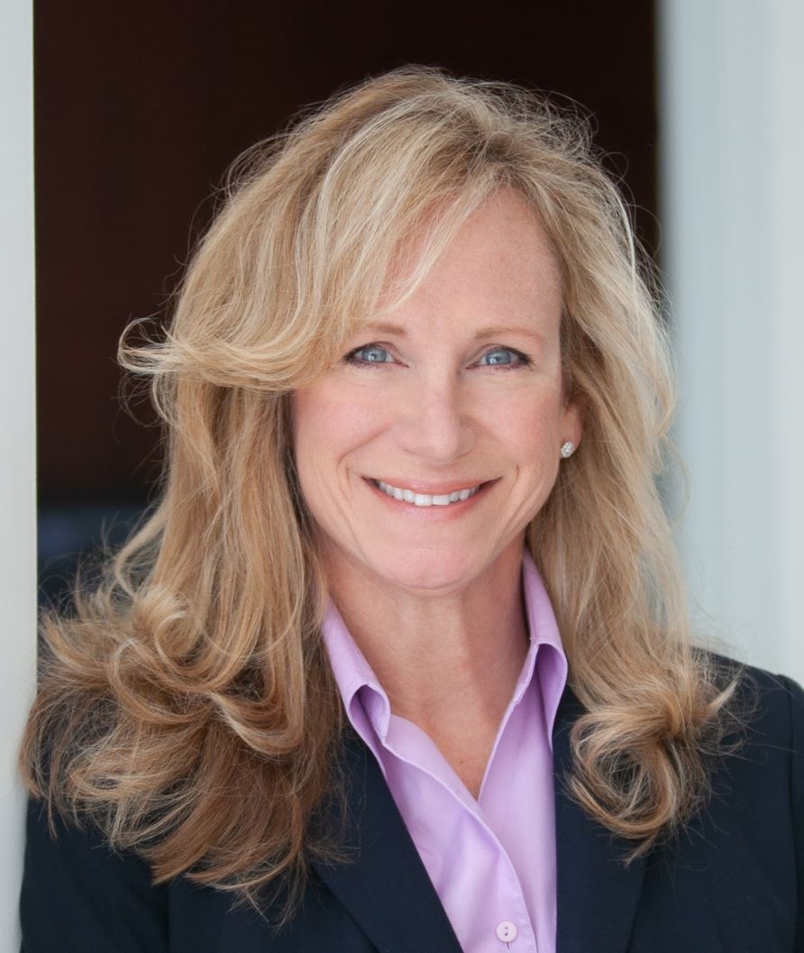 Portrait of Kelley Brown in a blue blazer and a lavender blouse