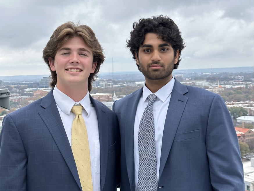A photo of two young men wearing coats and ties