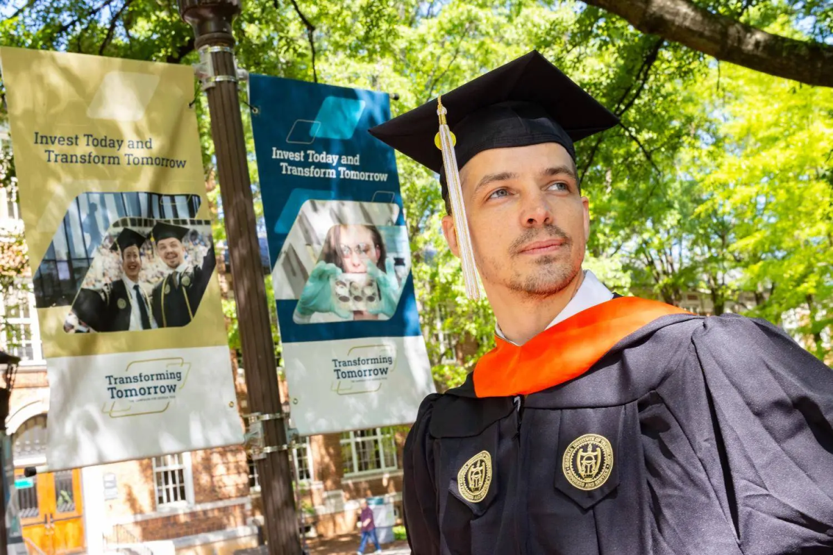 Thomas Vandiver in a cap and gown for graduation 