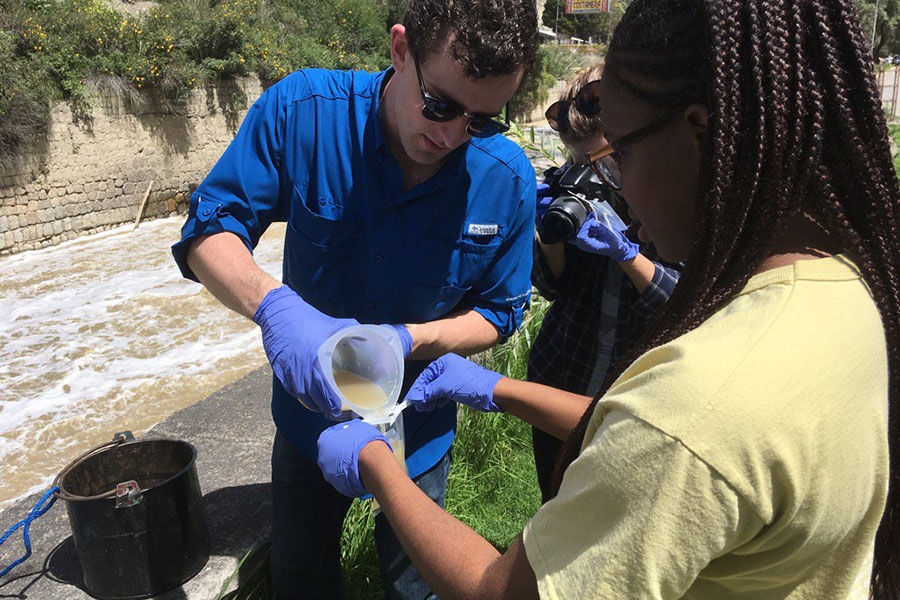 Students collect samples along the Choqueyapu River in La Paz, Bolivia, over spring break. They were one of three classes that traveled to three different continents this year. (Photo Courtesy: Joe Brown)