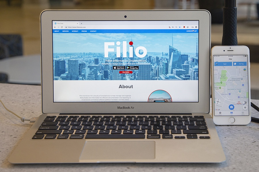 A laptop computer and iPhone show the Filio web app and mobile app, respectively. (Photo: Amelia Neumeister)