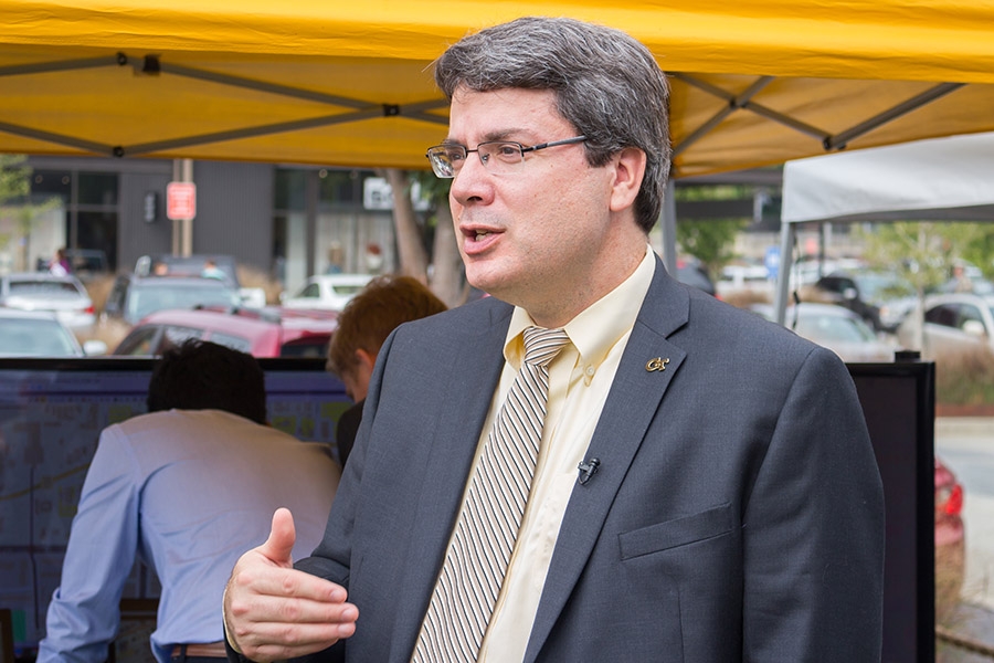 Associate Professor Michael Hunter explains his work with the North Avenue Smart Corridor at the ribbon-cutting event for the roadway. Hunter appeared on WABE-FM's Closer Look Sept. 26 to talk about his work on autonomous vehicles, one of the technologies that will be tested along North Avenue. (Photo Courtesy: Georgia Tech Institute for People and Technology)