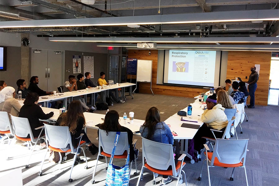 Students from the School of Civil and Environmental Engineering learn OSHA guidelines for worksite safety in early November. The Atlanta office of JE Dunn provided the training — and lunch — to the group of nearly two dozen undergraduate and graduate students. (Photo: Yong Cho)