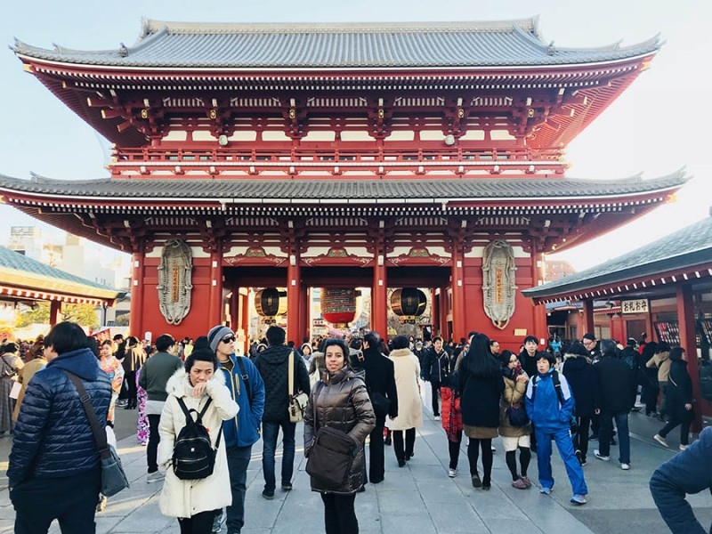 Fizza Hassan, center, stands in front of the Sensoji Buddhist Temple in Tokyo's Asakusa neighborhood. Hassan, a civil engineering master's student, traveled to the city with her classmates from an origami engineering course she took at Georgia Tech in the fall taught by Glaucio Paulino. The class visited attractions around Japan and learned about origami principles from Paulino's collaborators in the country. (Photo Courtesy: Fizza Hassan)