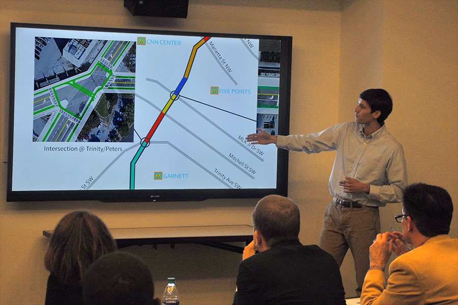 Andrew Pofahl explains to judges some of the design ideas his Delft Blauw Design team proposed for Ted Turner Drive in downtown Atlanta. Two teams of Georgia Tech students offered redesigns of the road for the Ted Turner Drive Resiliency Corridor Challenge. Delft Blauw Designs won second place in the competition. (Photo: Joshua Stewart)